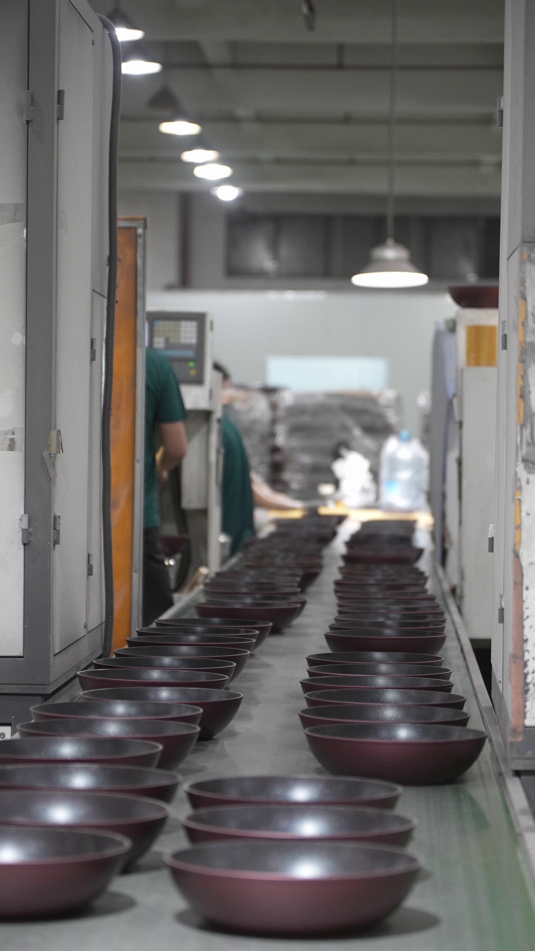 Rows of cookware across the YOUME production line